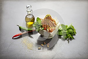 Lebanese food of Raw meat kibbe with oil and veggies