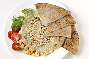 Lebanese hummus and pine nuts from above
