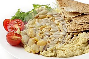 Lebanese hummus and pine nuts withoil