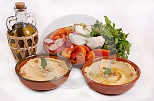 Lebanese hummus plate with olive & vegetables photo