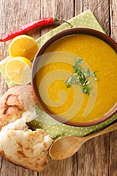 Lebanese Lentil Soup Shorbat Adas closeup in the bowl. Vertical top view photo