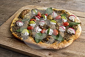 lebanese Manoushe ,bread of thyme topped with mint,, Zaatar flat bread