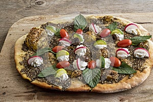 Lebanese Manoushe ,bread of thyme topped with mint,, Zaatar flat bread