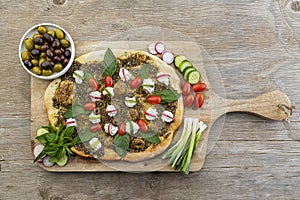 lebanese Manoushe ,bread of thyme topped with mint,, Zaatar flat bread