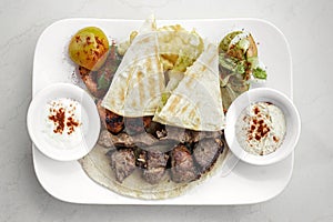 Lebanese meshwi mixed grilled meat set on plate