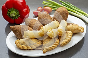 Lebanese Plate of Kebbeh, cheese rolls and meat pie