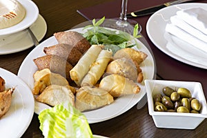 Lebanese Plate of Kebbeh, cheese rolls, and meat pie