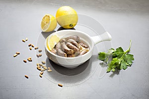 Lebanese starters of Makanek meat marinated, sausages fried in a frying pan