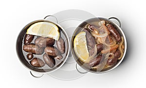 Lebanese starters of Makanek meat marinated, sausages fried in a metal pan photo