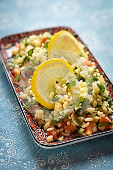 Lebanese tabbouleh salad with bulgur, parsley, tomato and cucmber