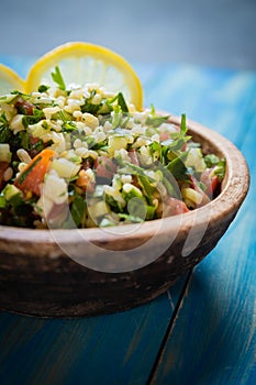 Lebanese tabbouleh salad with bulgur, parsley, tomato and cucmber