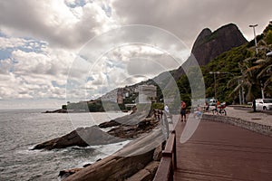 Leblon beatch deck on Rio de Janeiro with two brothers mountains