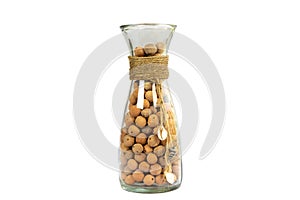 Leca Clay balls in a sleek glass bottle vase isolated on white background