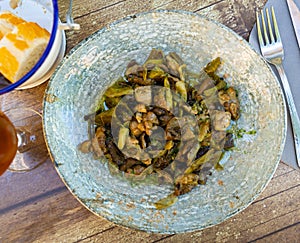 Lechecillas de ternasco. Roasted lamb gizzards served with stewed vegetables. Spanish dish photo