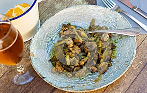 Lechecillas de ternasco. Roasted lamb gizzards served with stewed vegetables. Spanish dish photo