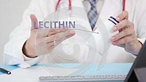 LECITHIN, a generic supplement, in the bottle in doctor`s hand