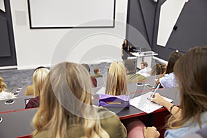 Lecture at university lecture theatre, audience POV, closer