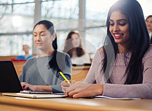 Lecturer and multinational group of students in an auditorium