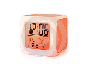 LED alarm clock isolated on white background. Modern style digital display.  Clipping paths object  Orange color