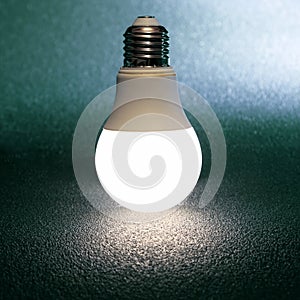 Led bulb included on a dark background. everyday household item in electricity