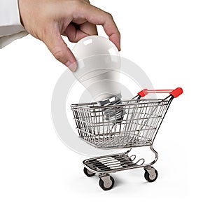 LED bulb with shopping cart for energy saving concept.