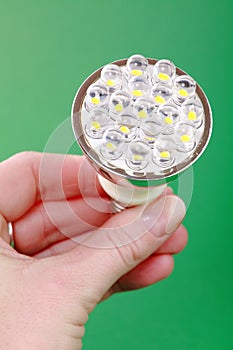 Led bulb in woman's hand