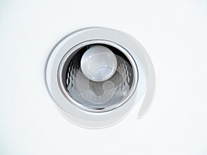 LED ceiling light. Downlight with light bulb on white ceiling background