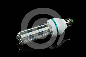 Led  energy saving lamps on black isolated background. on the glass