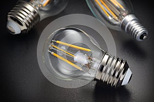 LED filament bulb on black