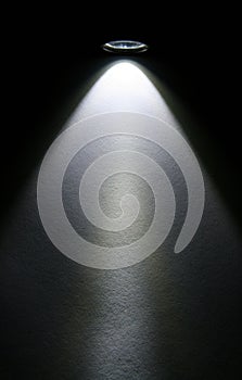 LED flashlight beam on paper.