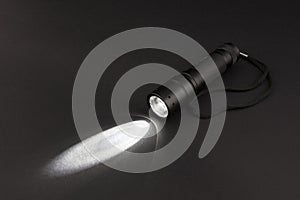 LED flashlight with a light beam photo