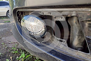 Led fog light of a modern car, replacing and repair. White lights bad for driving