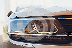 Led headlight of car, image close-up part of automobile.