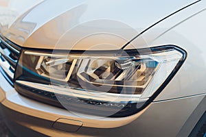 Led headlight of car, image close-up part of automobile.