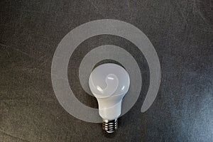 LED light bulb on a gray background