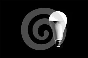 LED light bulb lit on a black background