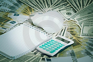 LED light bulb and money. Banknotes dollars and euros are laid out on the table