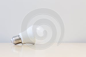 LED light bulb on table with white background