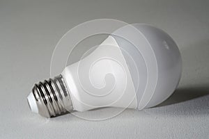 Led light bulb on a white canvass surface