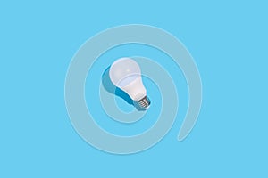 LED light bulbs on blue color background. Flat lay with copy space. Concept ecology, save planet earth