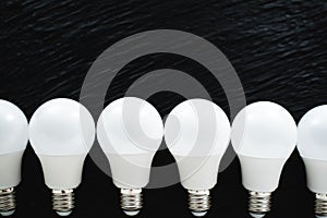 Led light bulbs white light on black textured background