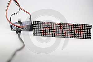 LED matrix display showing the number 2024 and is controlled by a programmable micro controller. Electronic number digital display