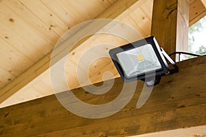 Led projector with motion sensor in outdoor carport