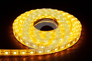 Led silicon shining strip in coil. Diode lights.Electrotechnology concept. photo