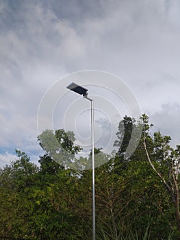 Led solar street light over tree and sky