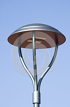 Led street lamp against blue sky