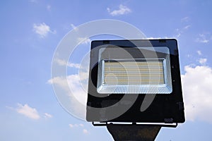 LED street lamp post on blue sky background