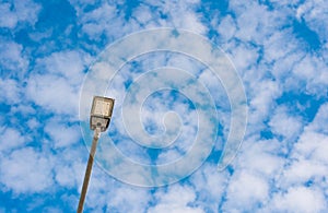 Led street light close up, blue sky with white clouds