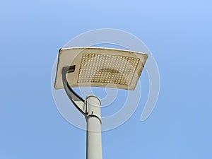 Led streetlight on a pole against clear blue sky background. Modern energy-saving technologies for lighting streets and roads. Led