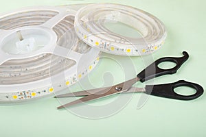led strip and scissors for installing decorative light